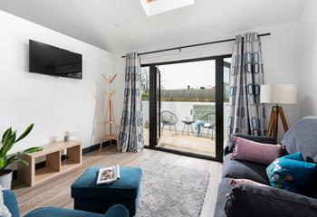 The sitting room is stylish and homely, the patio doors take advantage of the peaceful countryside location so you can enjoy the sights and sounds.