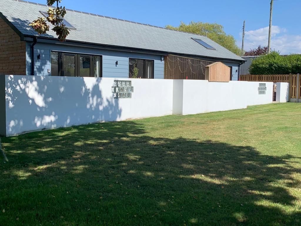 The grass area is shared with the adjoining property, The Coop, also available to book.