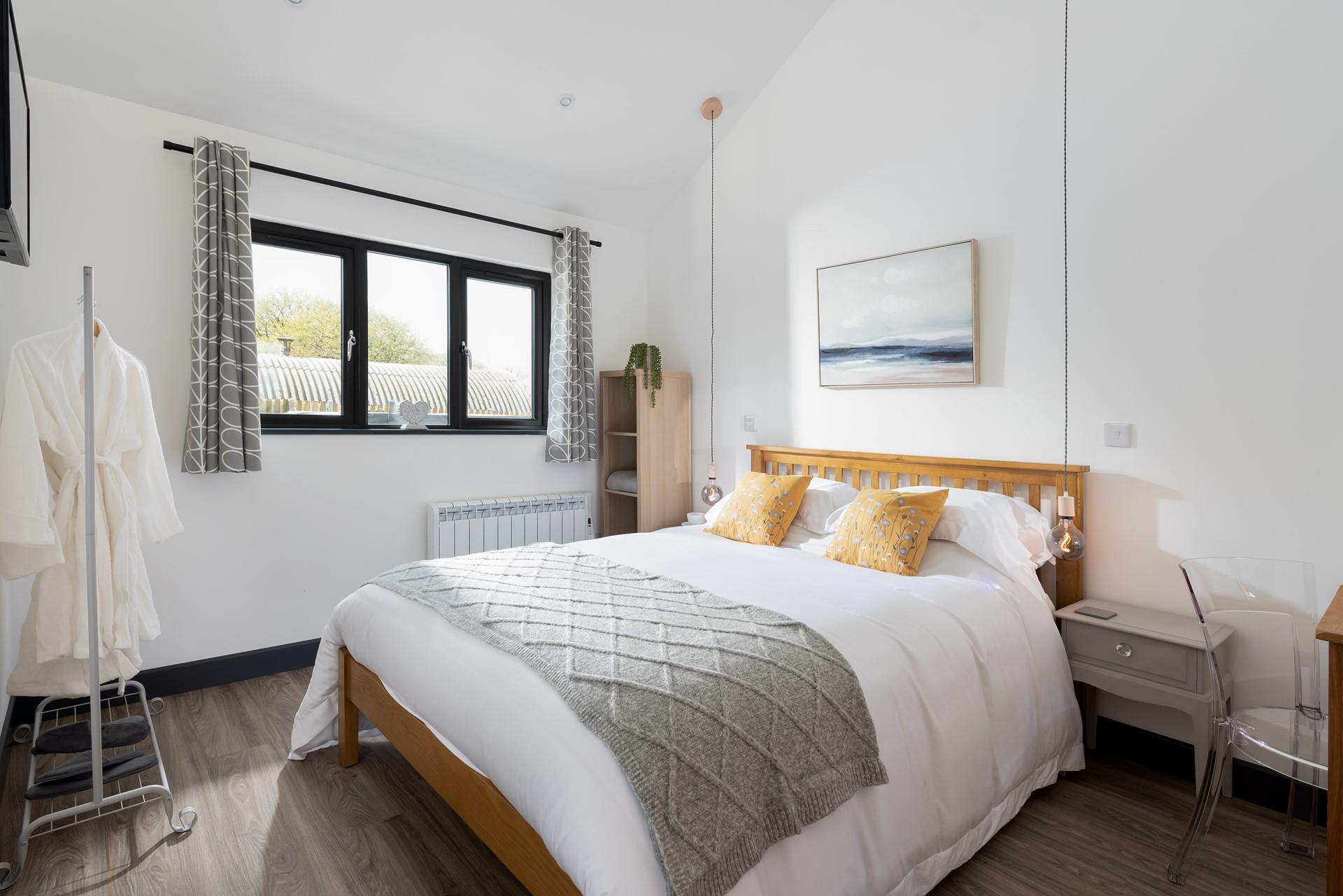 The sumptuous king size bed provides you with a blissful night's sleep.