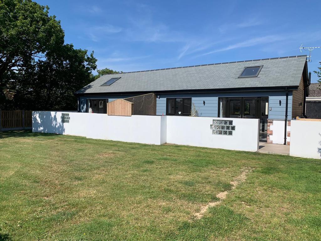 The enclosed grass area is perfect for letting the dogs run off some steam.