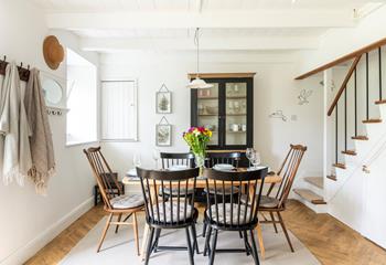 Open the front door into the bright dining room, the perfect space for a leisurely breakfast.