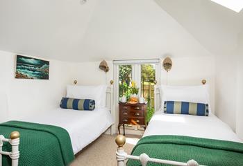 Bedroom 3 has twin beds, suitable for adults and children alike.