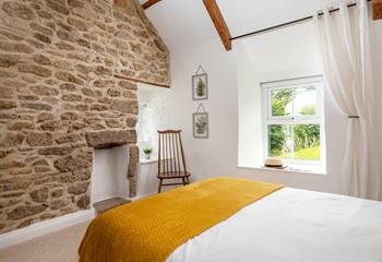 Traditional features like the feature wall create a cosy cottage feel.