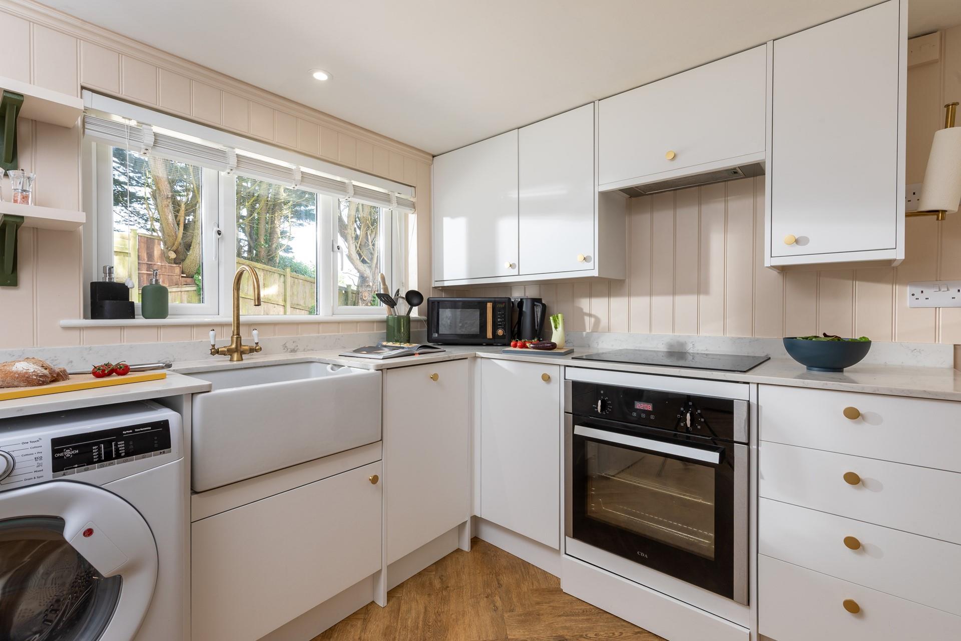 The kitchen is modern and well-equipped with all the appliances you need.