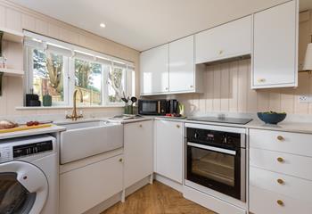 The kitchen is modern and well-equipped with all the appliances you need.