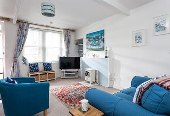 Sink into the sofa in the comfortable sitting room and enjoy pure relaxation.