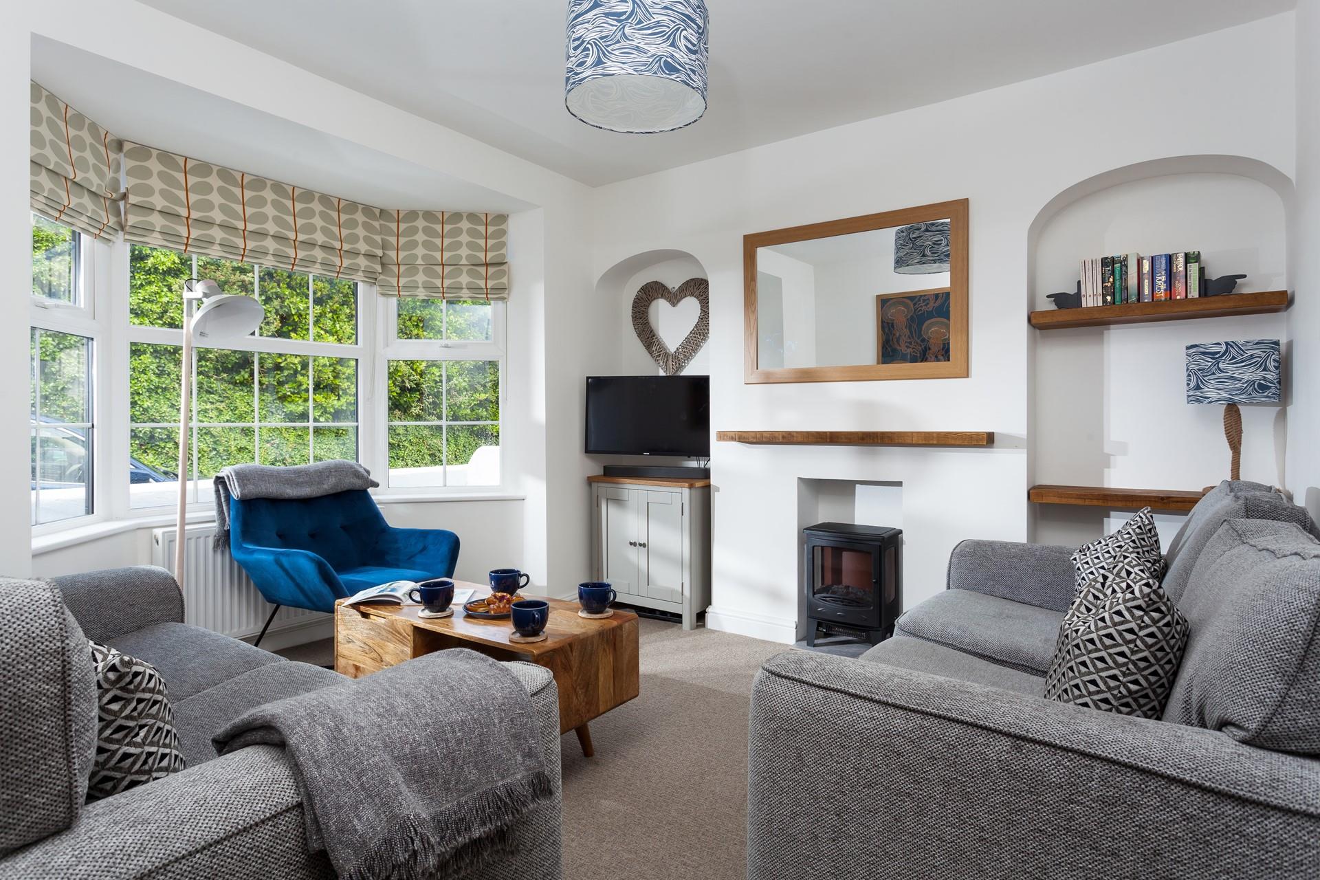 Sink into the plush grey sofa and relax with our favourite tipple in the evening.