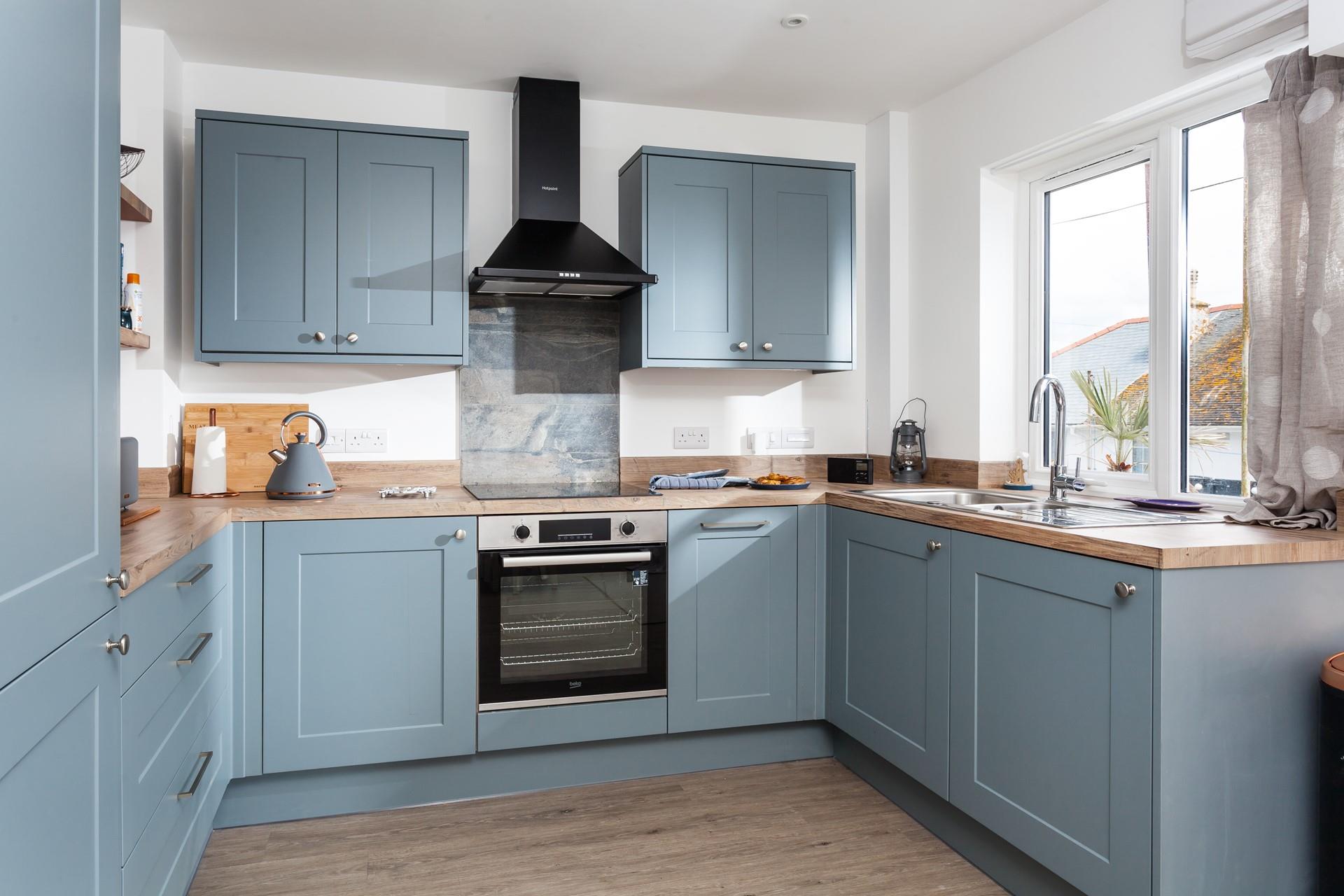 The modern kitchen is well-equipped for all your culinary needs.