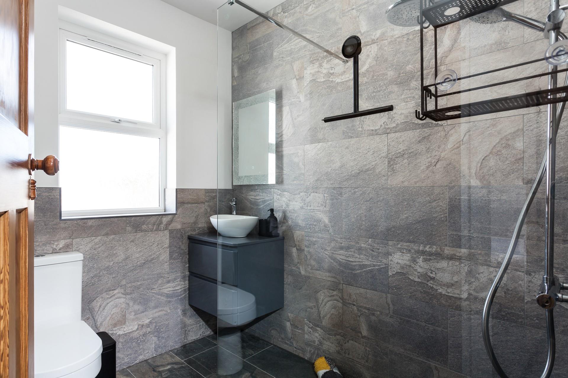 The modern and stylish shower room is an ideal space to get ready each morning.