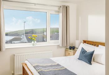 Bedroom 2 has a cosy double bed and an en suite shower room.