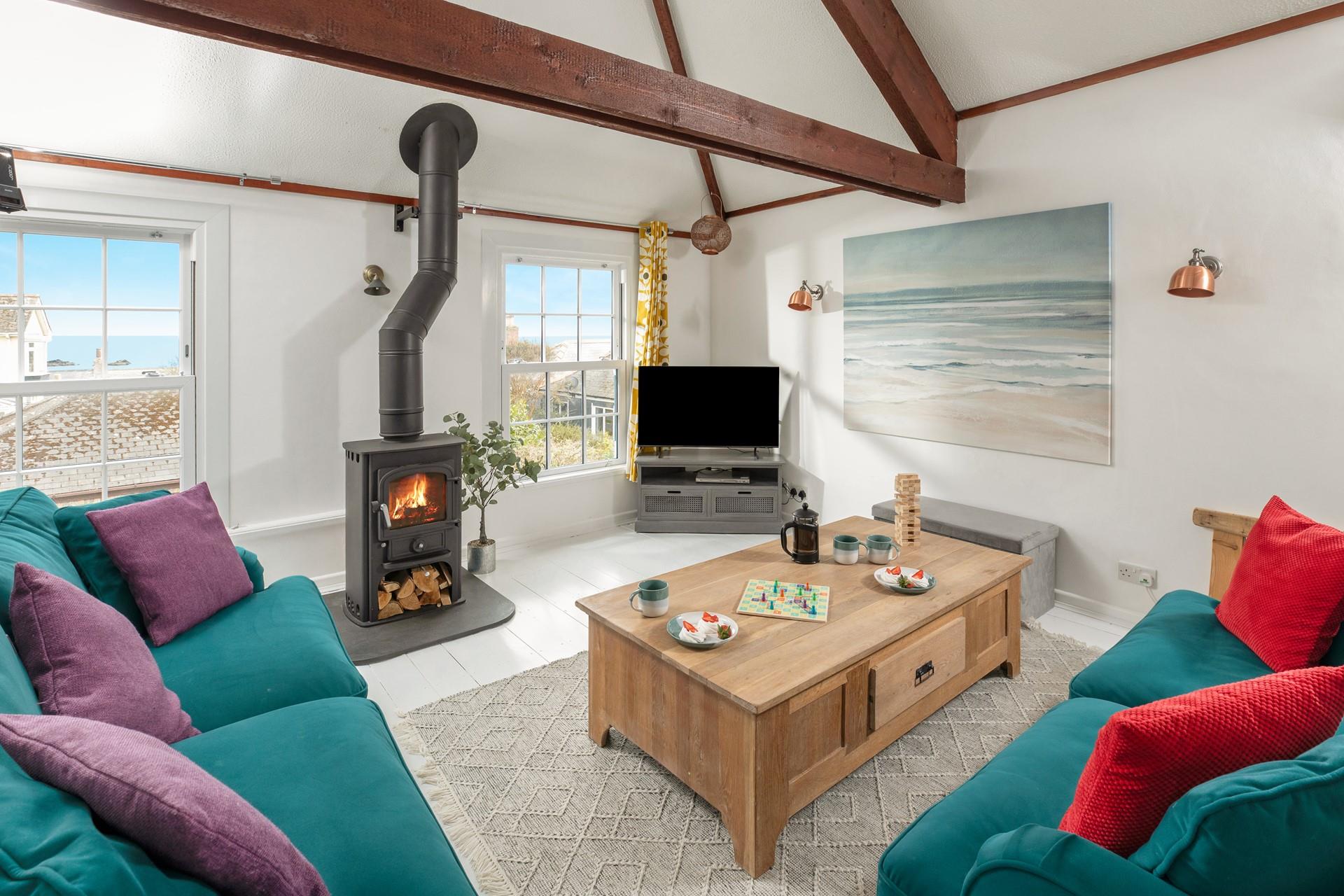 Sink into the sofa with the woodburner roaring, gazing at the sea view from the window.
