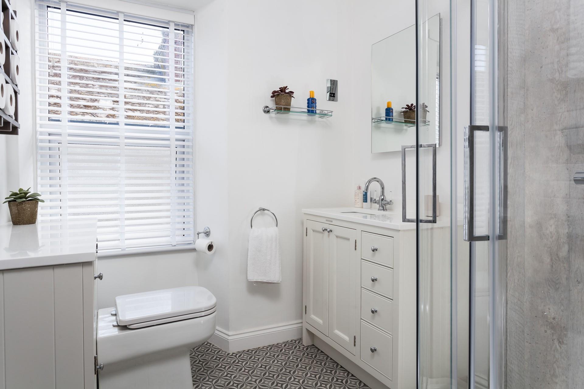 Get ready in the modern bathroom for a day on the beach.