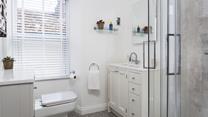 Get ready in the modern bathroom for a day on the beach.