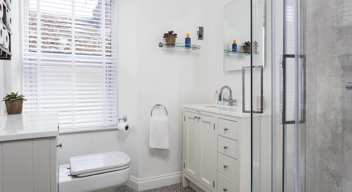 Get ready in the modern bathroom for a day on the beach.