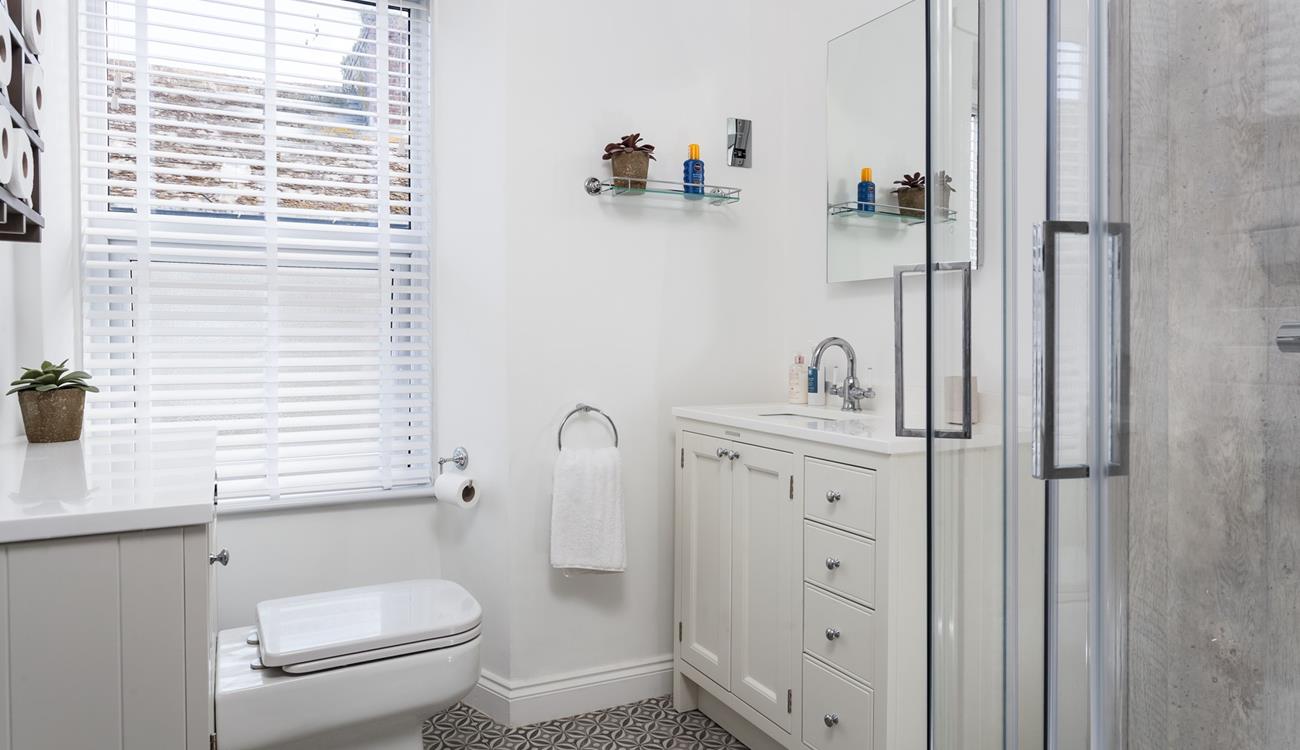 Get ready in the modern bathroom for a day on the beach.