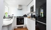 Cook up a storm in the modern and sleek kitchen. - Thumbnail Image