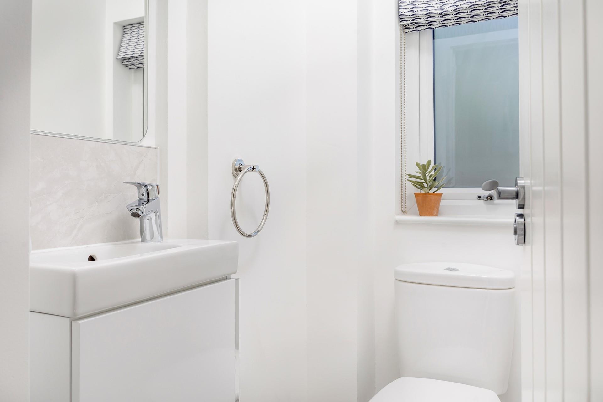 The cloakroom has a WC and basin.