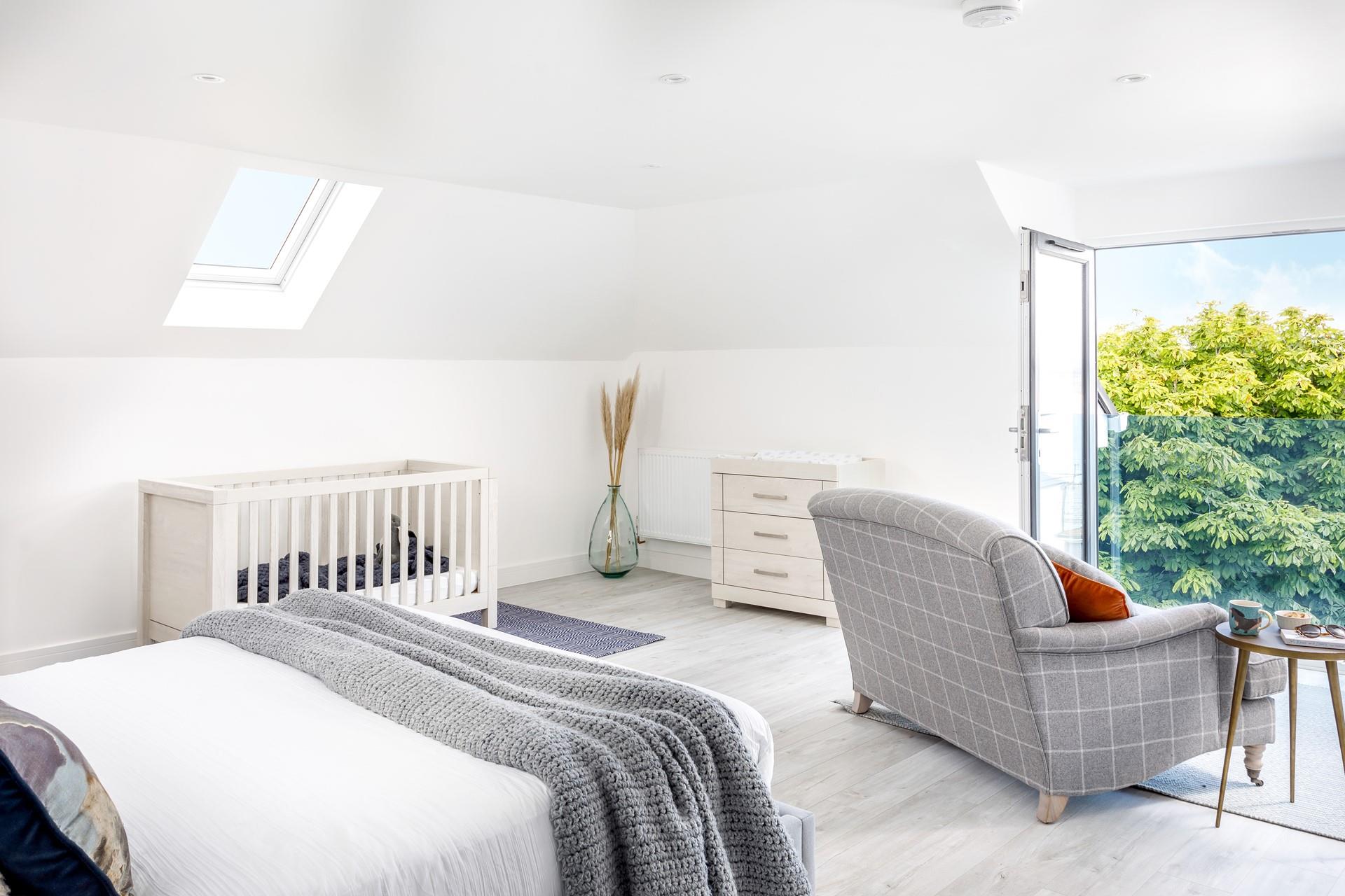 Bedroom 3 has a spacious king size bed and a comfy sofa to enjoy the views.