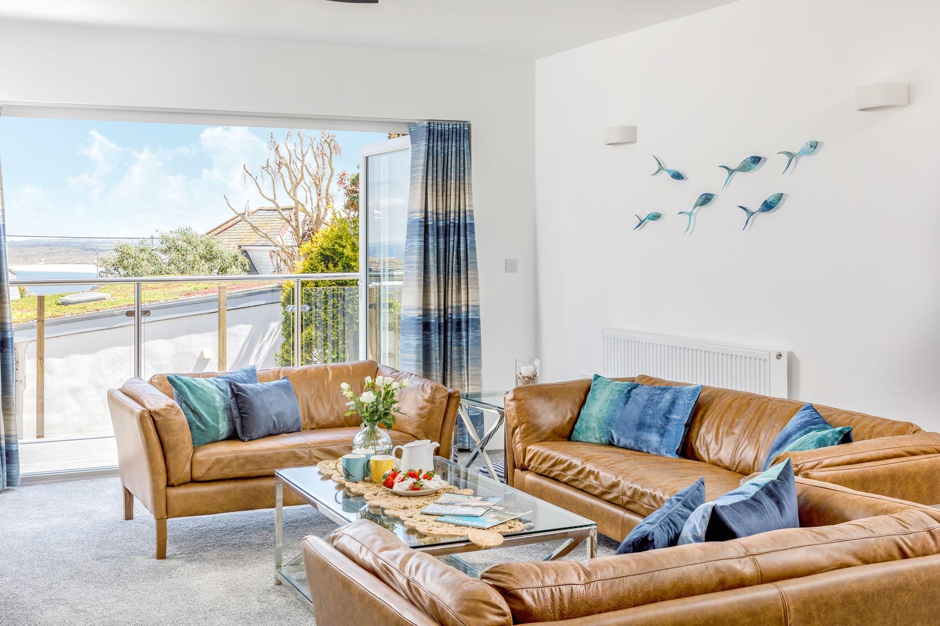 The spacious sitting room is decorated with calming blue and turquoise tones.