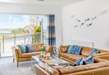 The spacious sitting room is decorated with calming blue and turquoise tones.