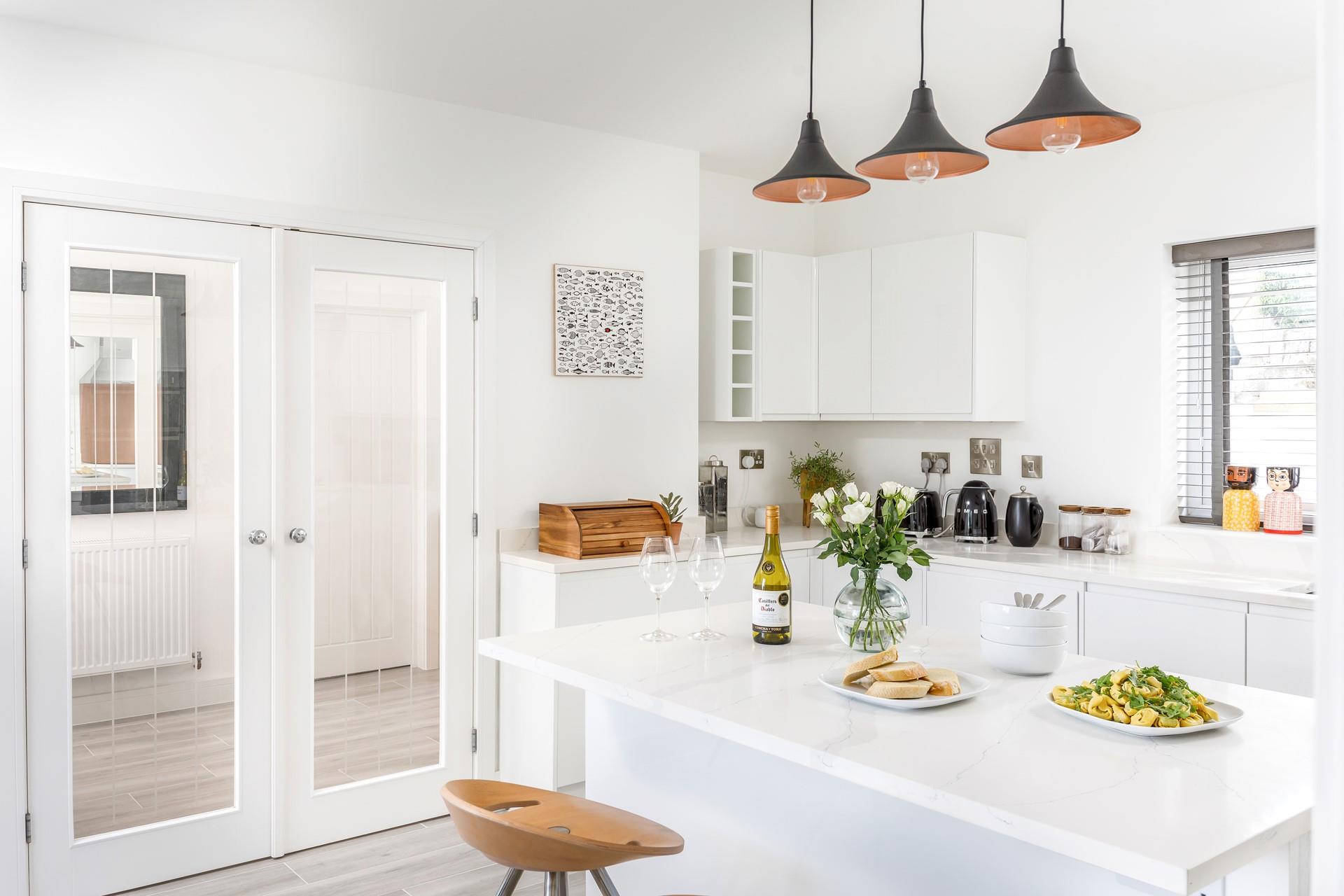 The modern and sleek kitchen is perfectly equipped to cook up a storm.