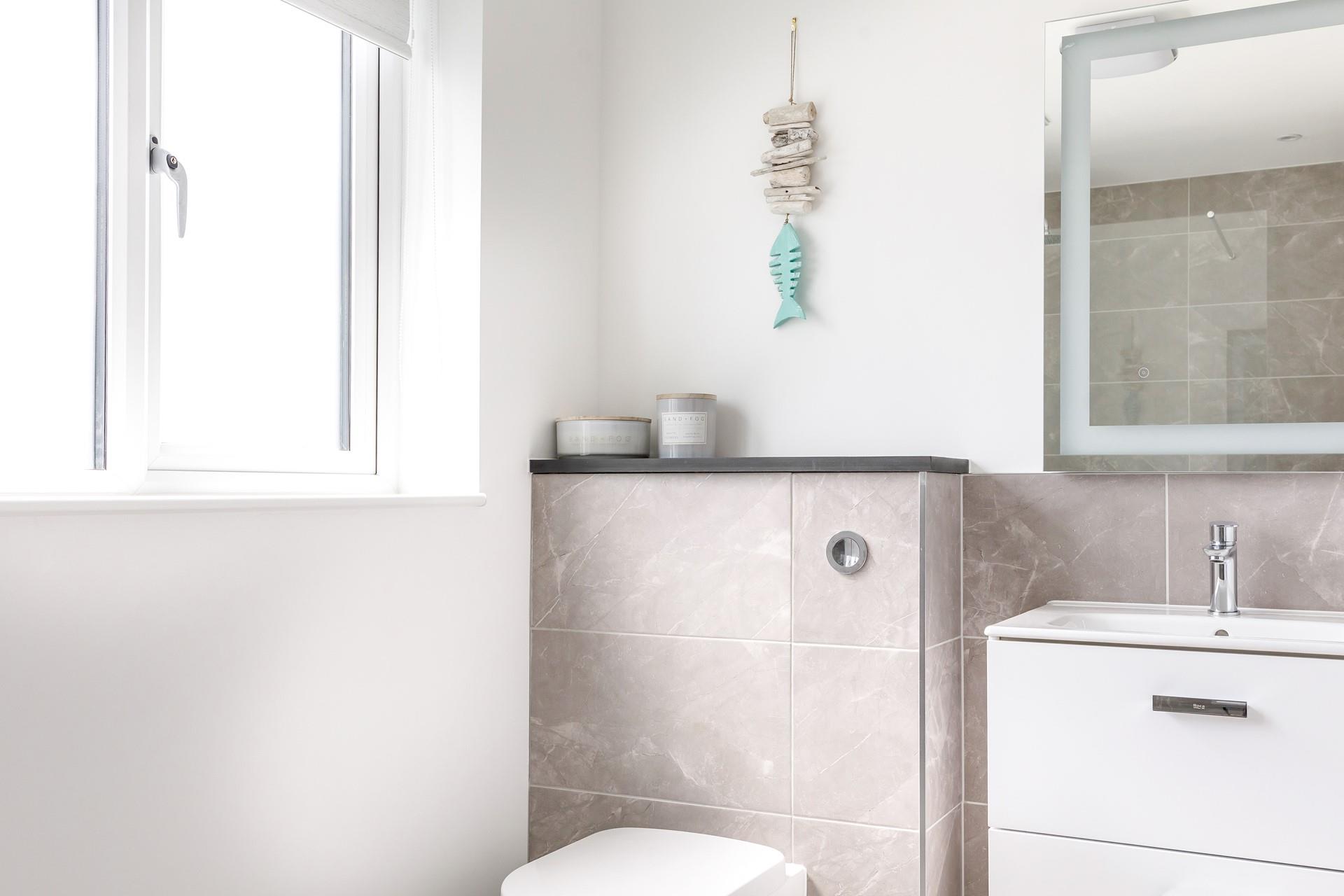 Get ready for the day in front of the light-up mirror.