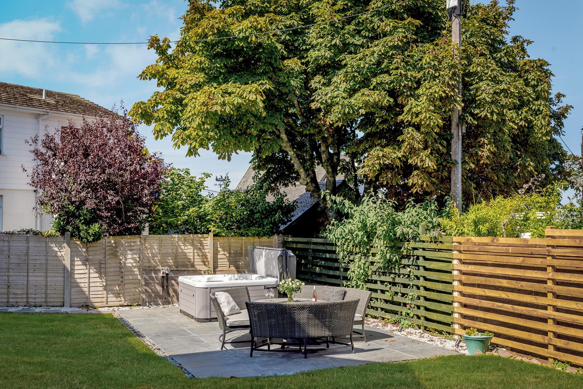 Take a dip in the hot tub with a glass of something cold in hand.