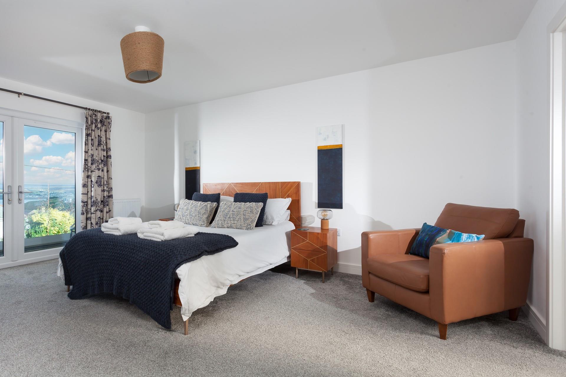 Each bedroom has soft carpets and comfy beds.