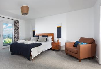 Each bedroom has soft carpets and comfy beds.