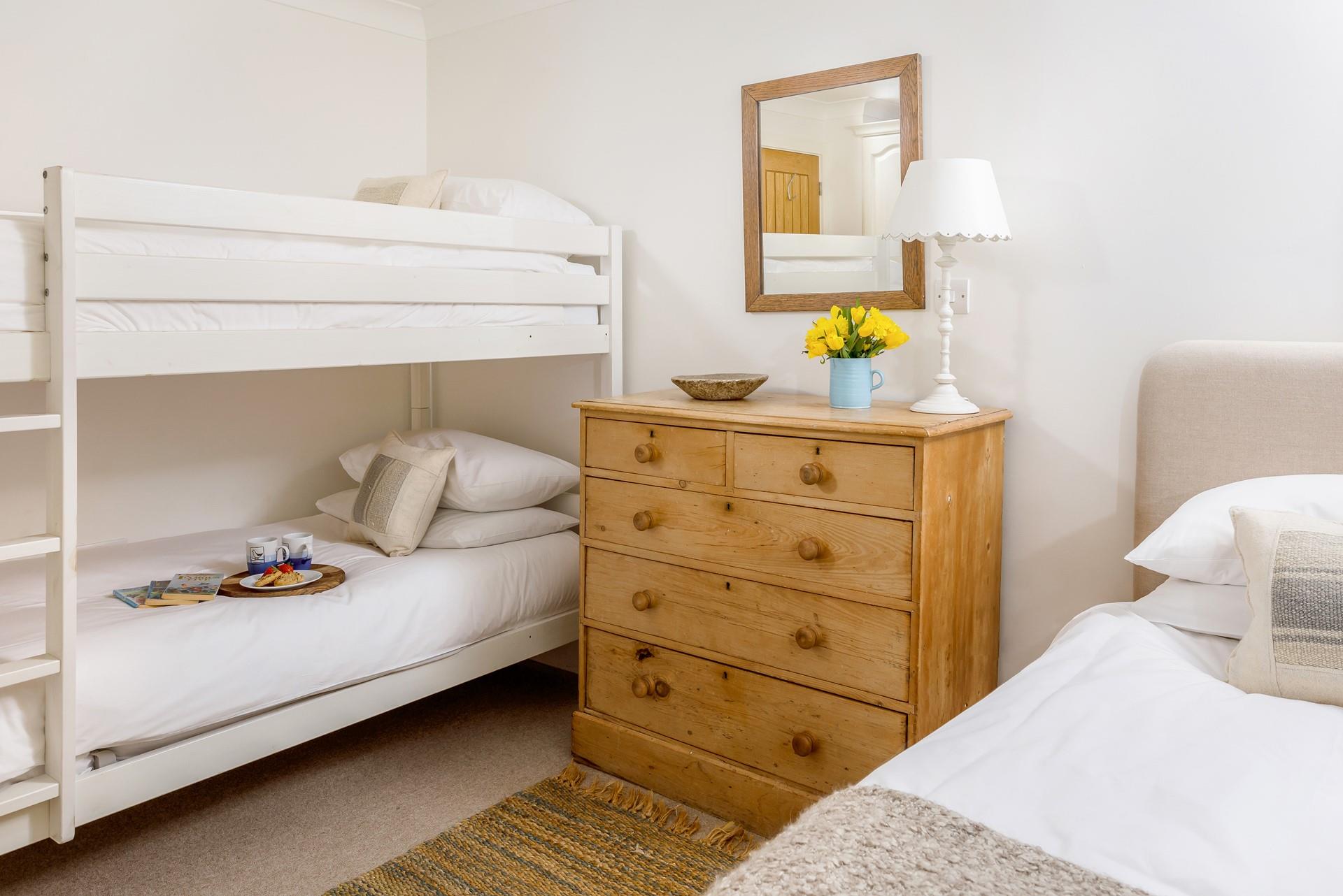 Bedroom 4 has bunk beds and a single bed, perfect for the kids to share.
