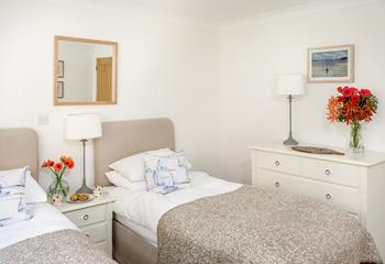 The twin beds are perfect for adults or children to tuck into.