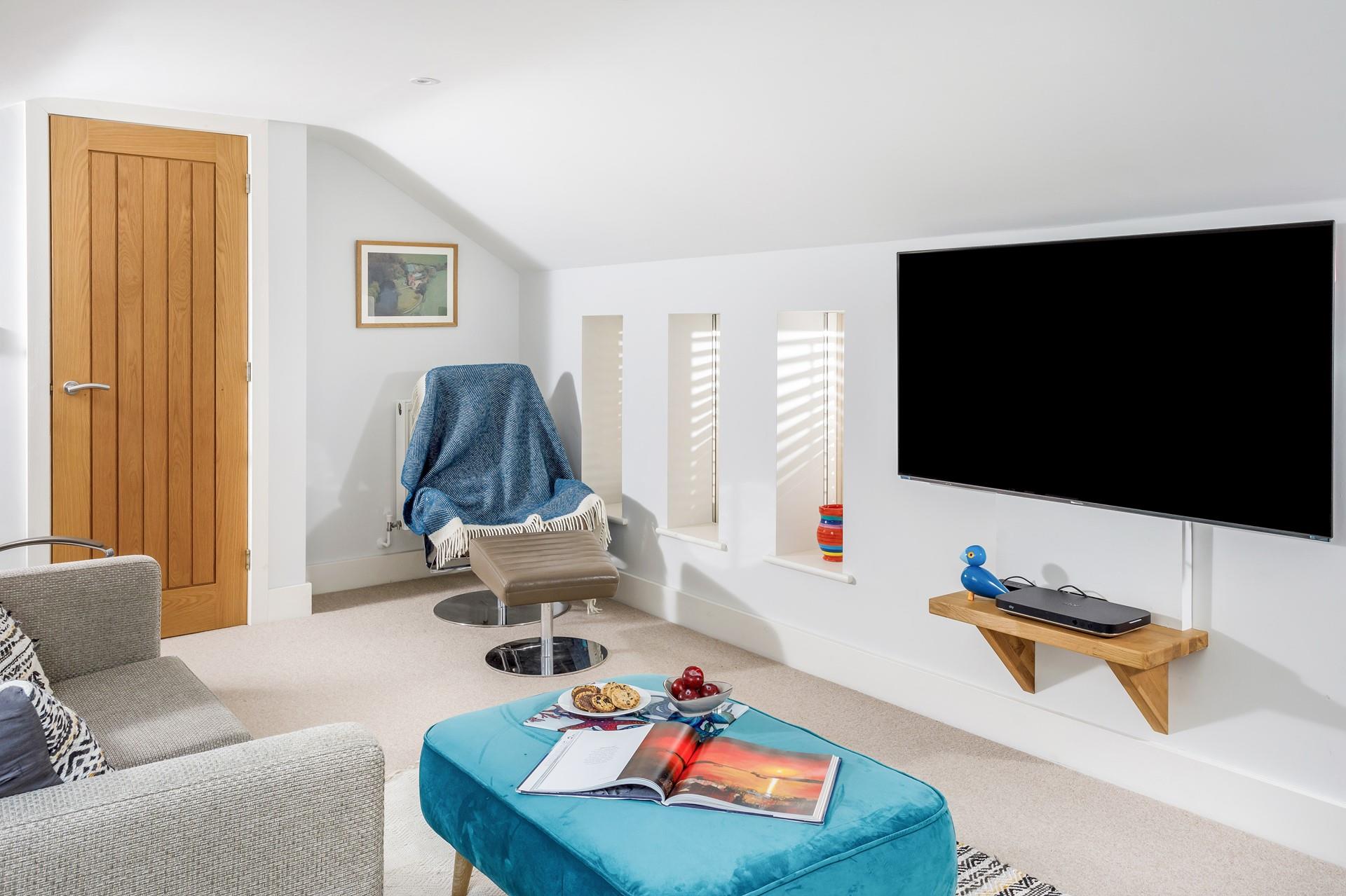 Settle in for a family movie night in the upstairs snug.