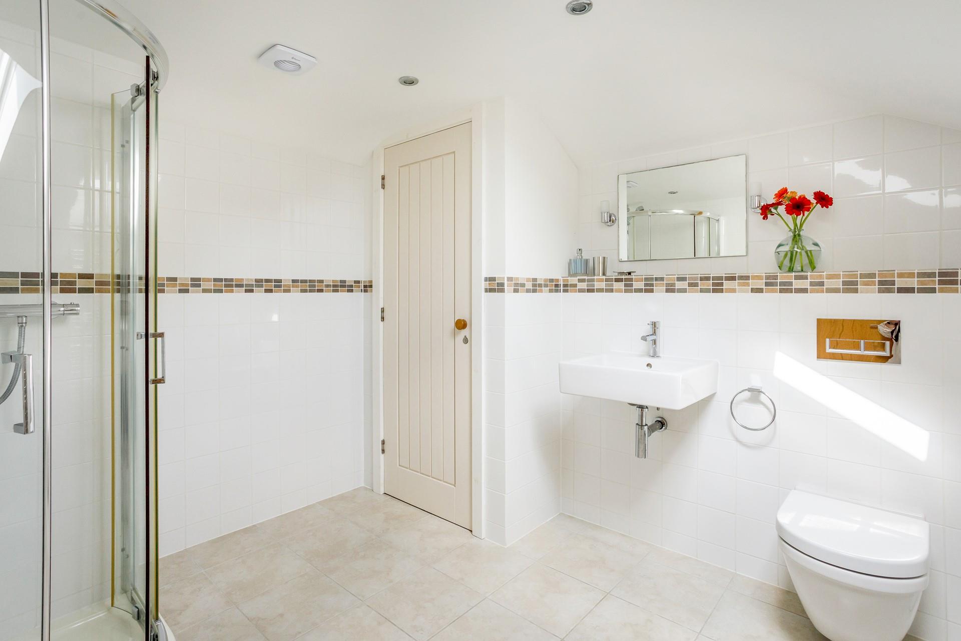 Get ready for the day in the spacious bathroom.