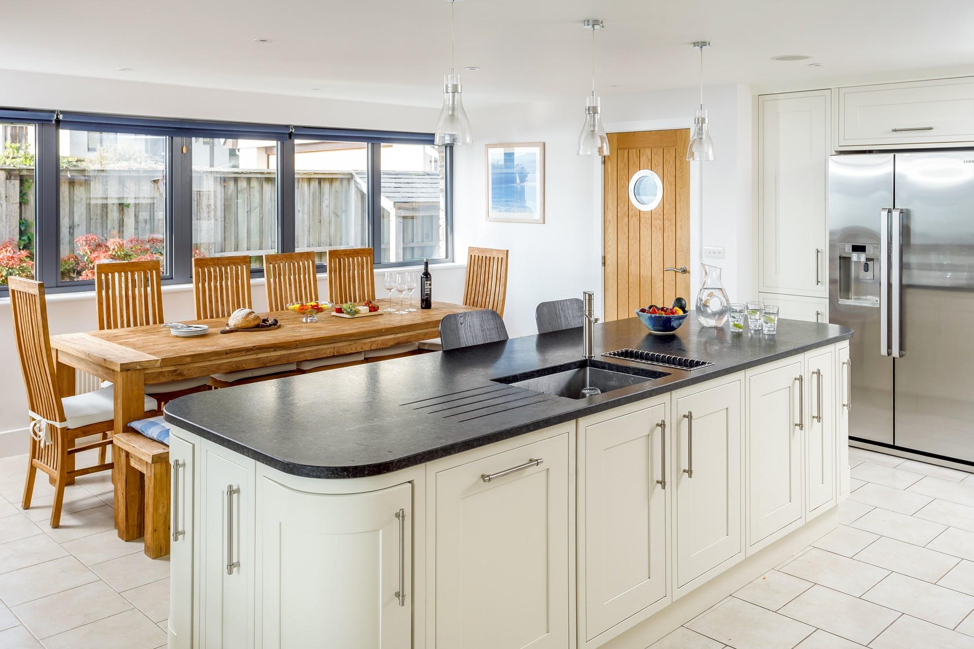 The dining table has plenty of seating for all guests to spend quality time together.