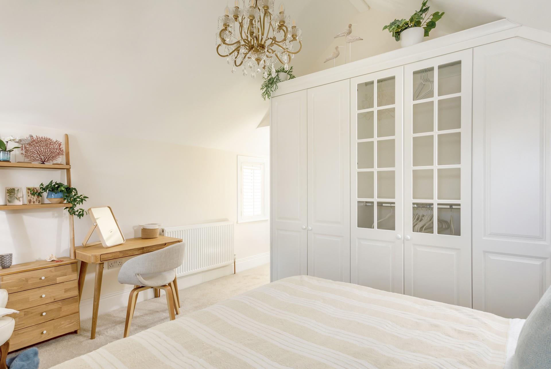 Bedroom 1 has stylish touches with its chandelier style light and dressing table perfect for getting ready in the morning.