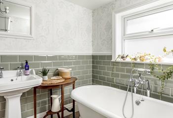The bathroom is stylishly decorated and is a haven for relaxation.