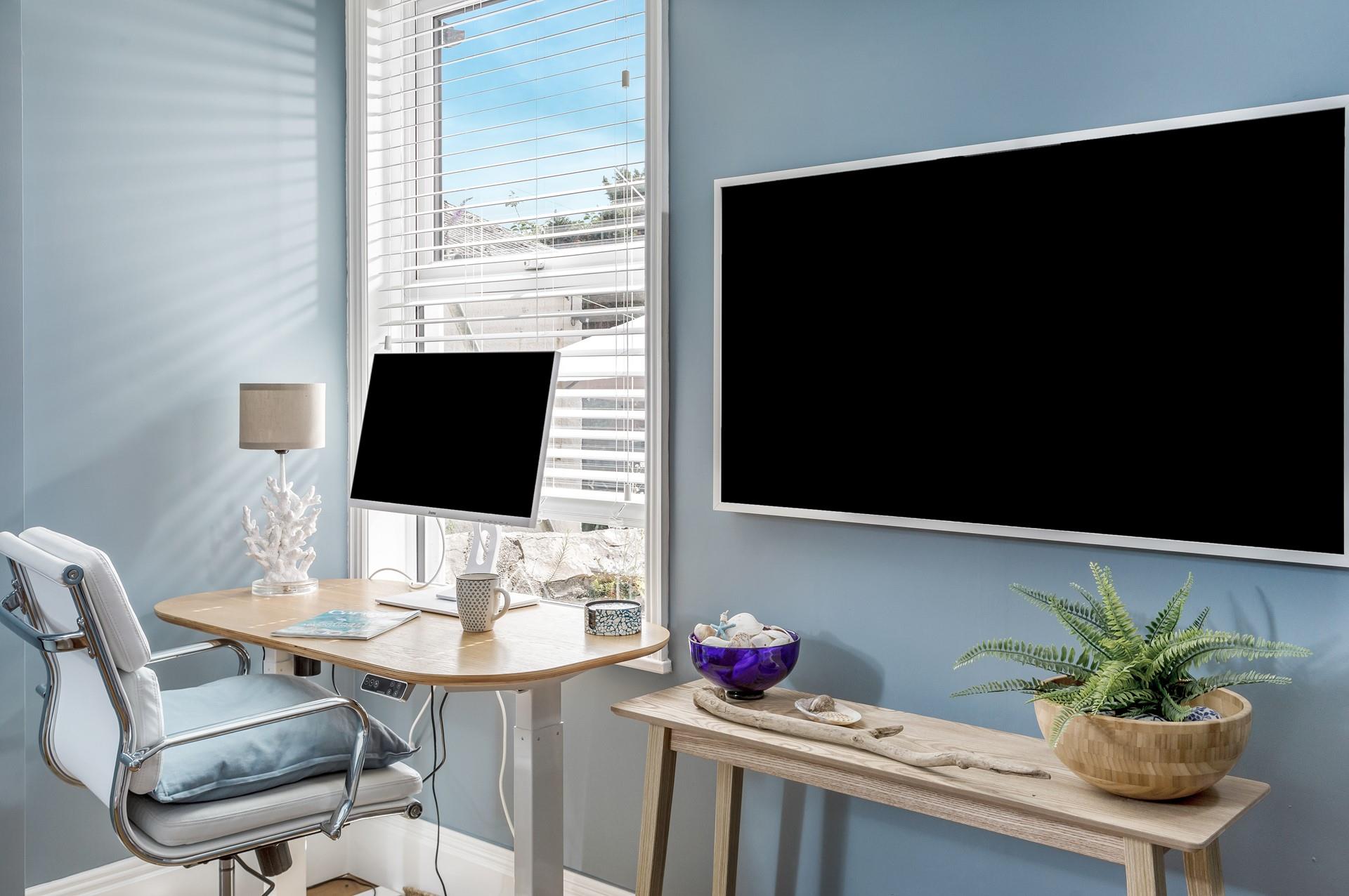 The snug room has a large smart TV, perfect for movie nights.