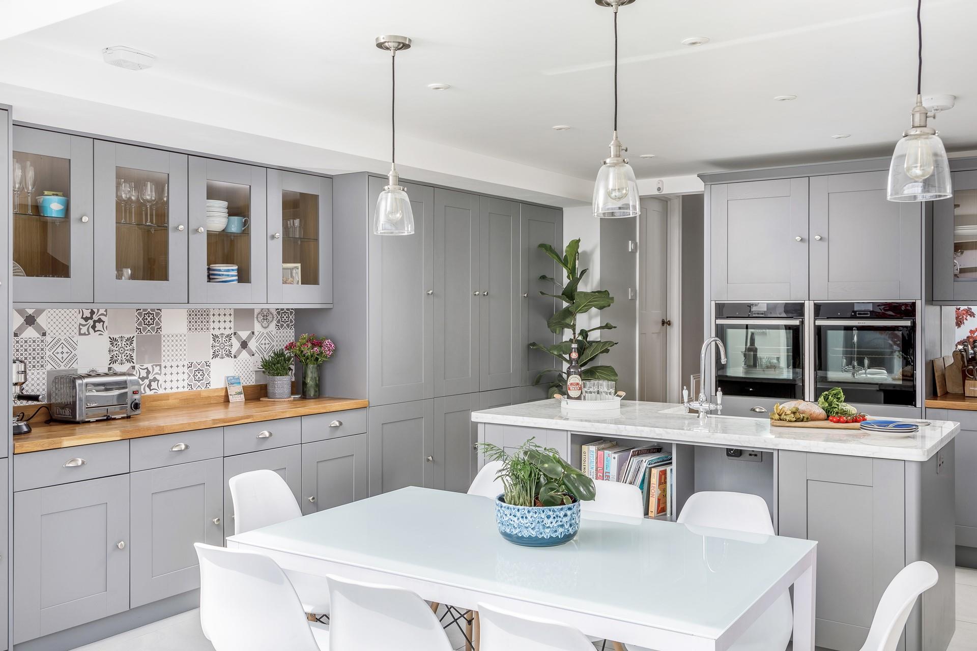 The open plan living and dining area is modern and stylish, perfect for spending quality time together as a family.