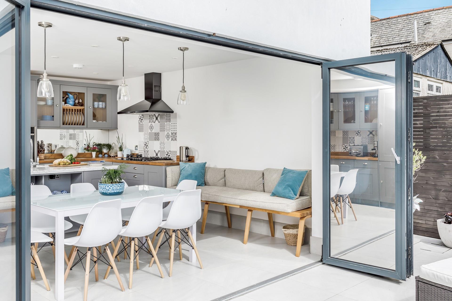 Open the doors and embrace al fresco living in this stylish home.