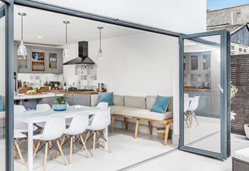 Open the doors and embrace al fresco living in this stylish home.