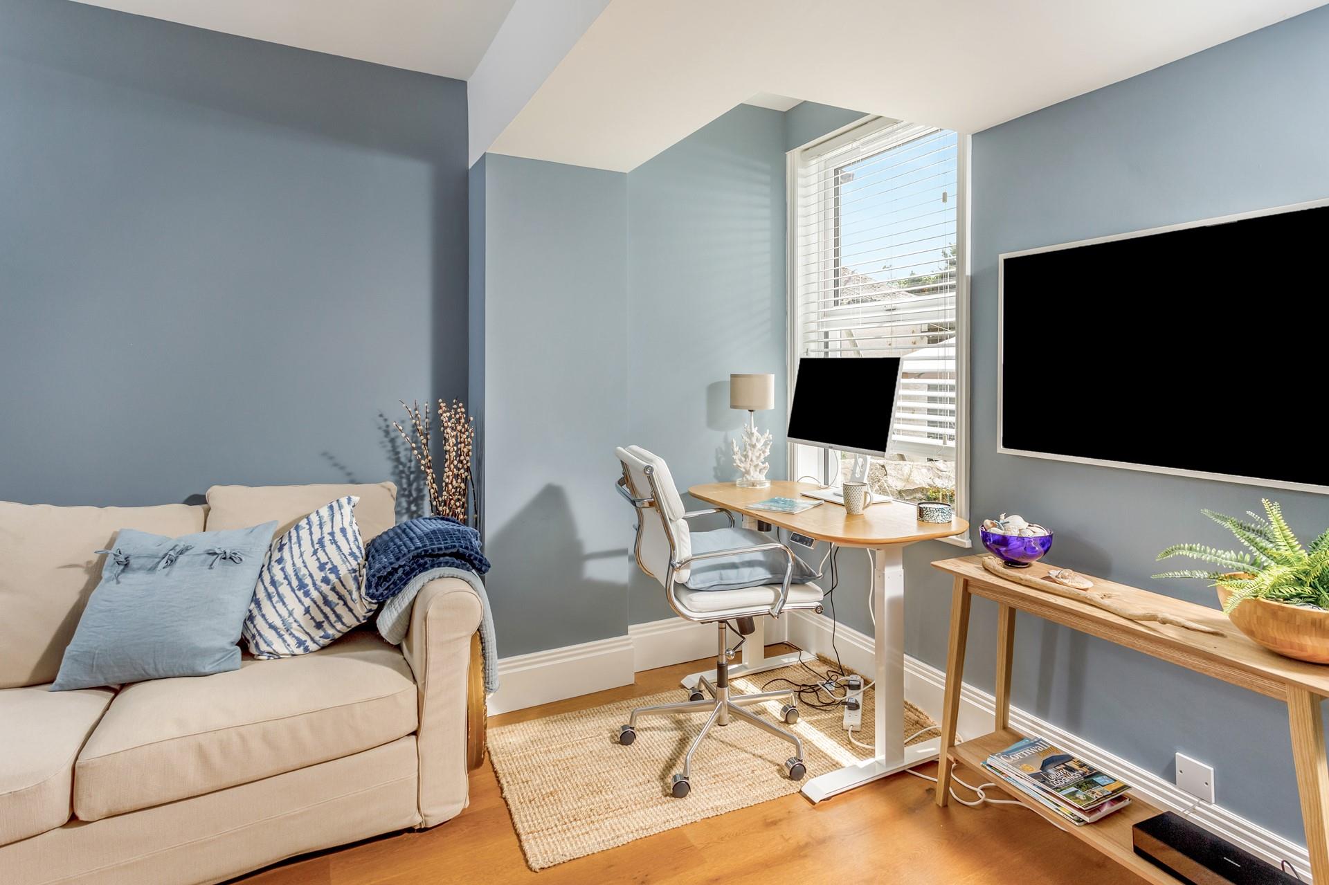 The snug room has a handy desk area making it the perfect property to work from.