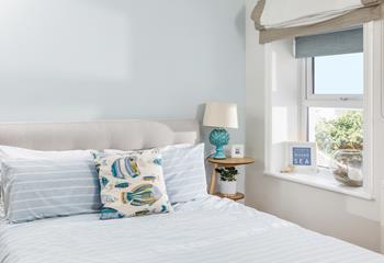Sink into the memory foam mattress and drift off surrounded by calming blue decor.
