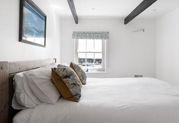 Bedroom 1 has seaside-inspired interiors and the perfect base to rest your head each night.