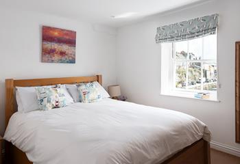 Bedroom 2 is bright and colourful, wake up to views of the harbour while you sip your morning cuppa.