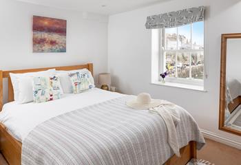 Watch the sunrise over the harbour when you wake.