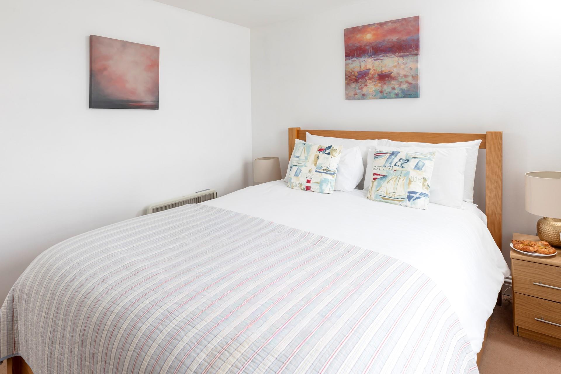 Bedroom 2 is bright and colourful, wake up to views of the harbour while you sip your morning cuppa.