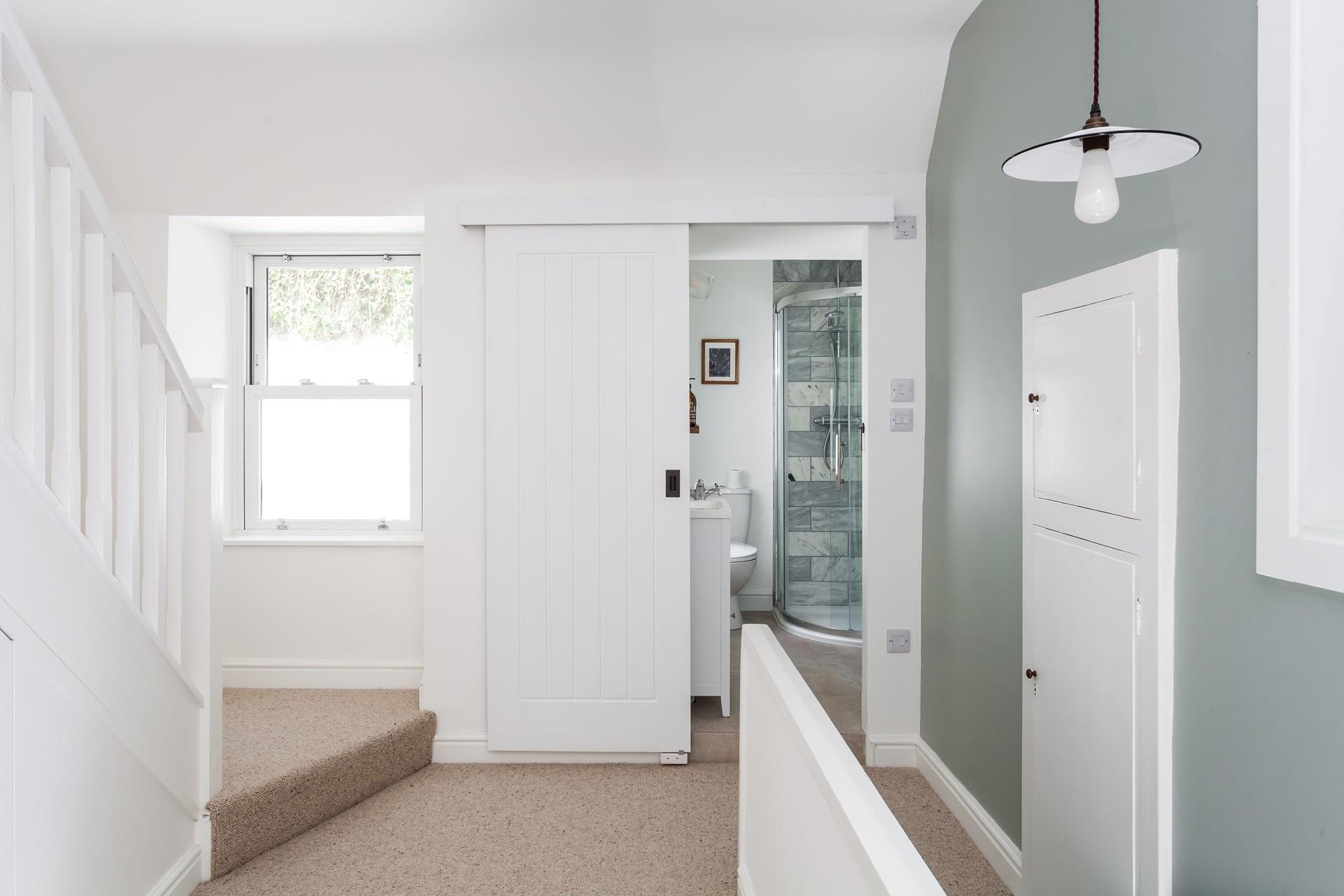 4 Mount Pleasant is decorated in calming, coastal hues creating a relaxing haven.