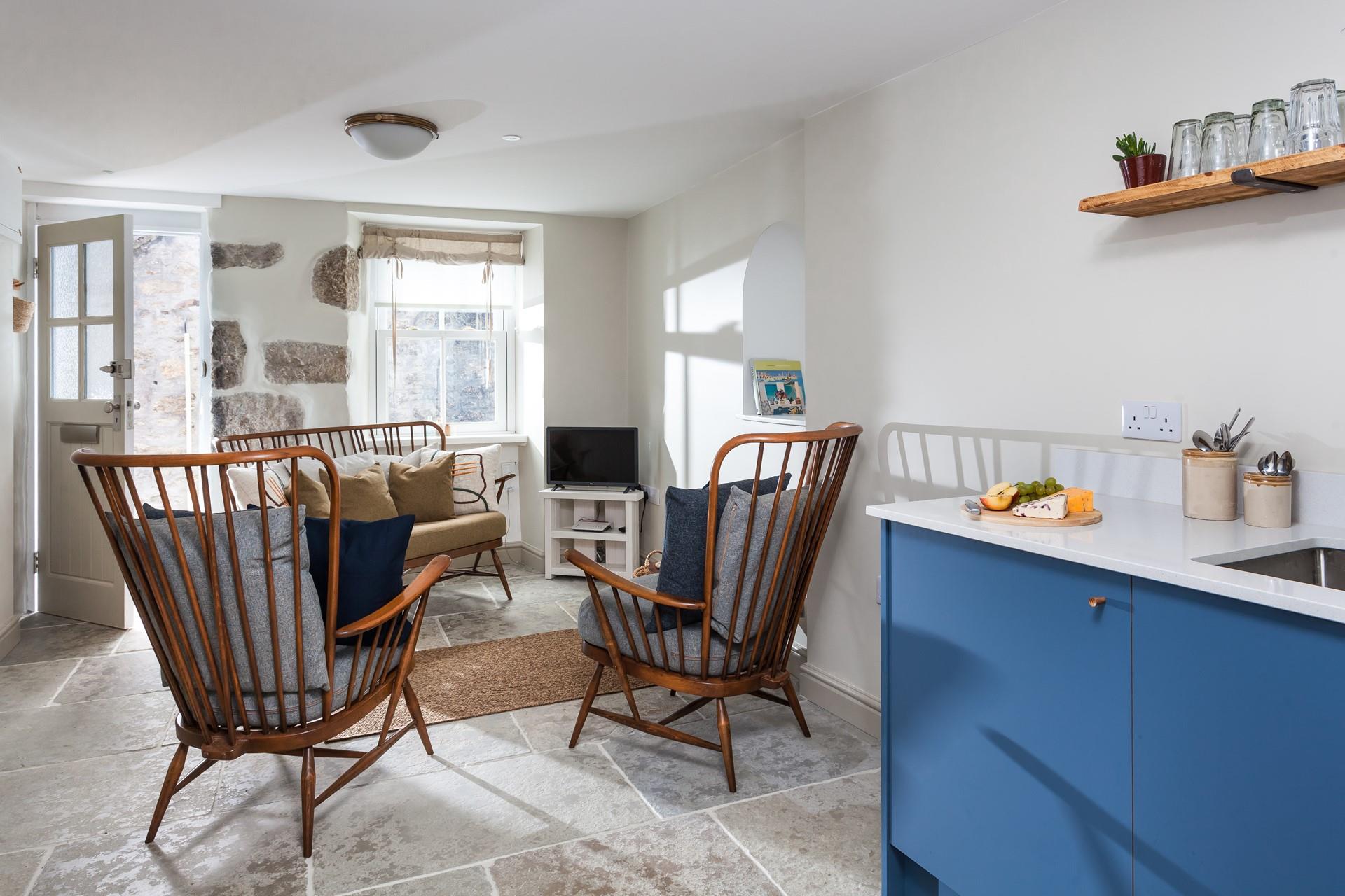 The light and airy open plan living space is a tranquil place to lounge or dine together.