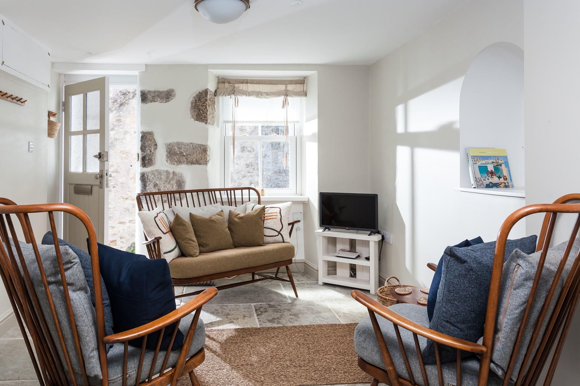 This charming sitting room provides you with a place to relax and unwind after a day exploring St Ives' quaint streets.