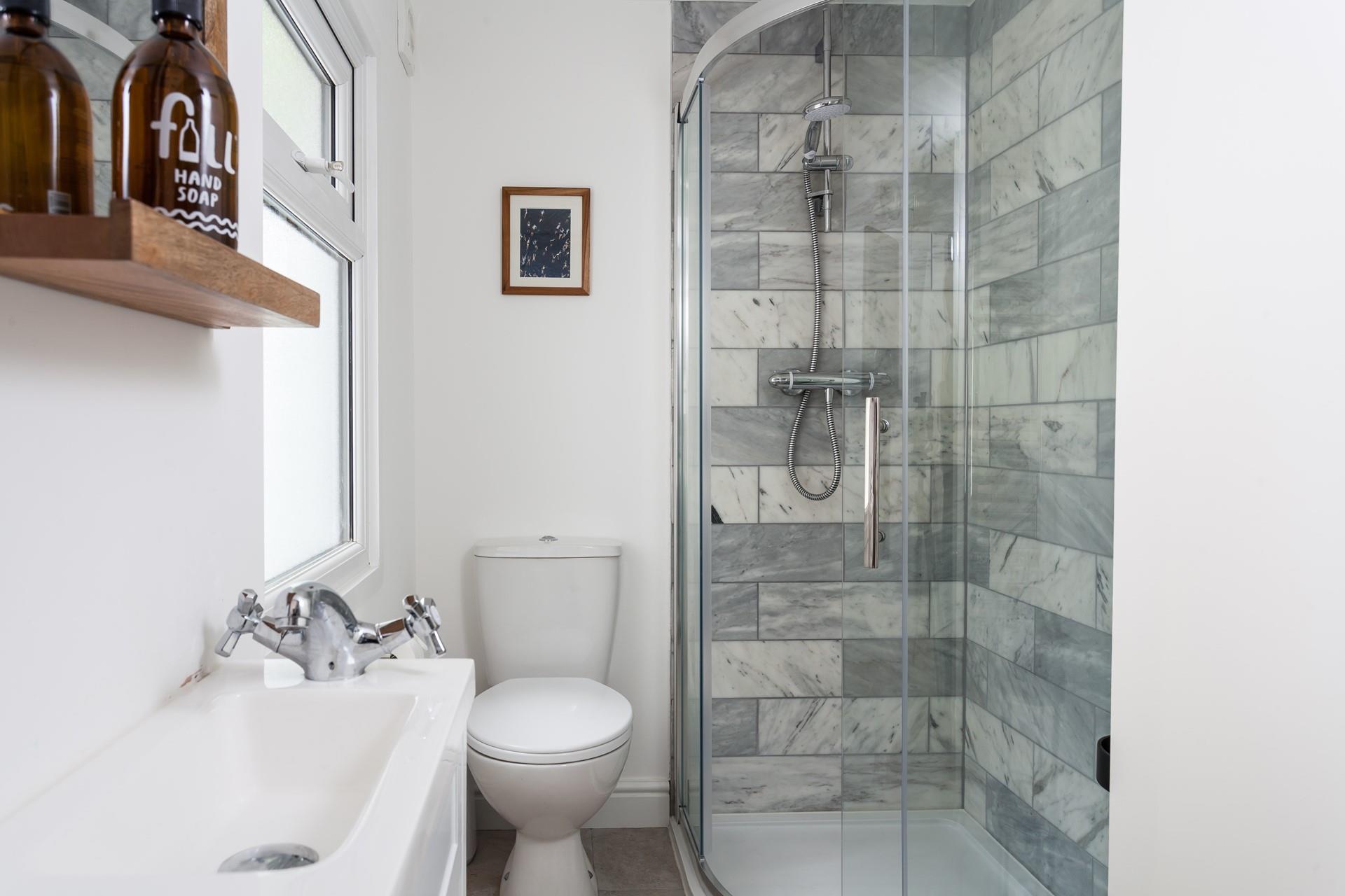 Wash off your sandy toes in the modern shower room.
